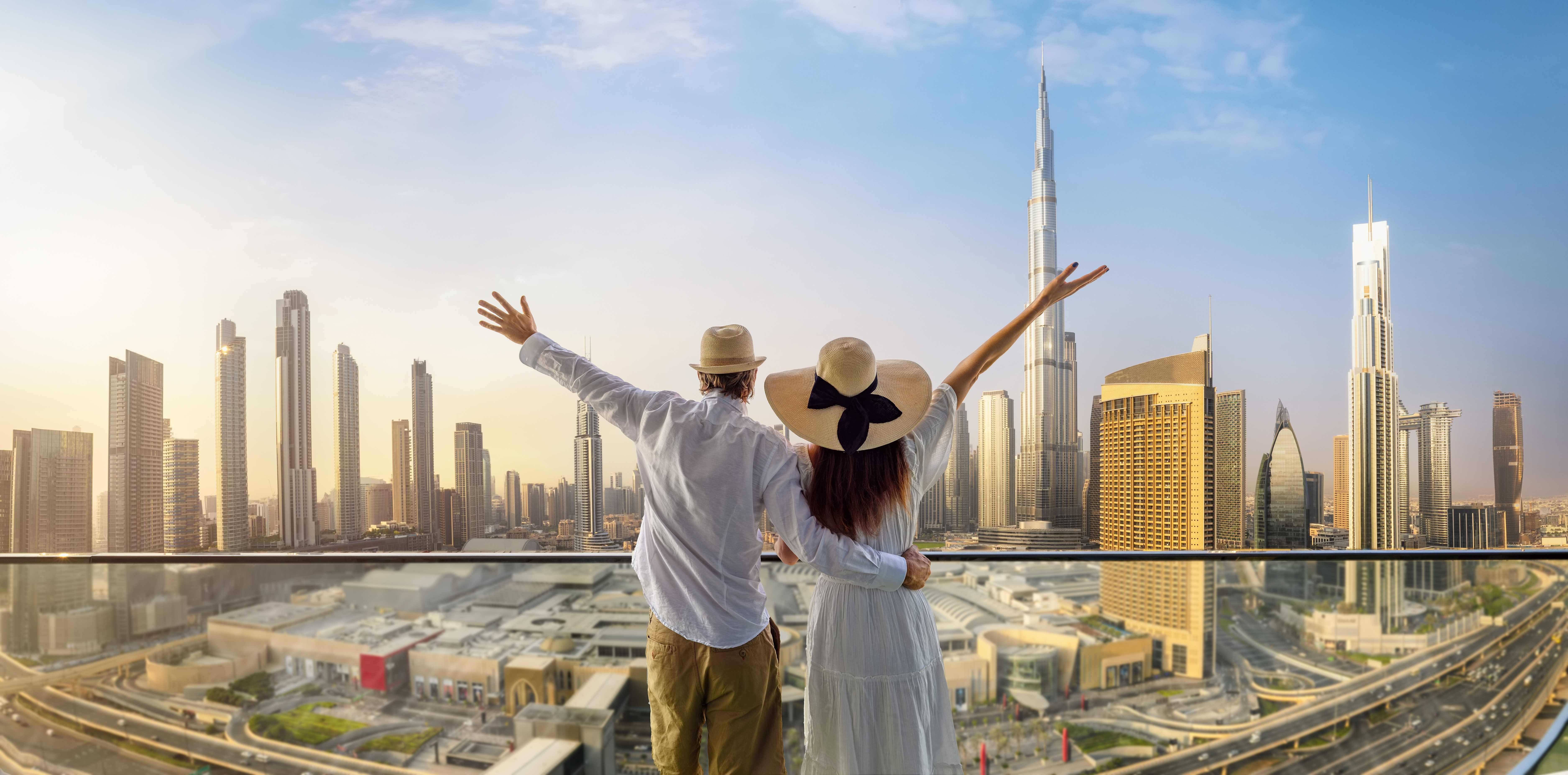 Couple enjoying Dubai skyline view with Burj Khalifa